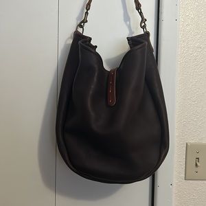 Go Forth Goods Celeste large hobo with button stud closure.